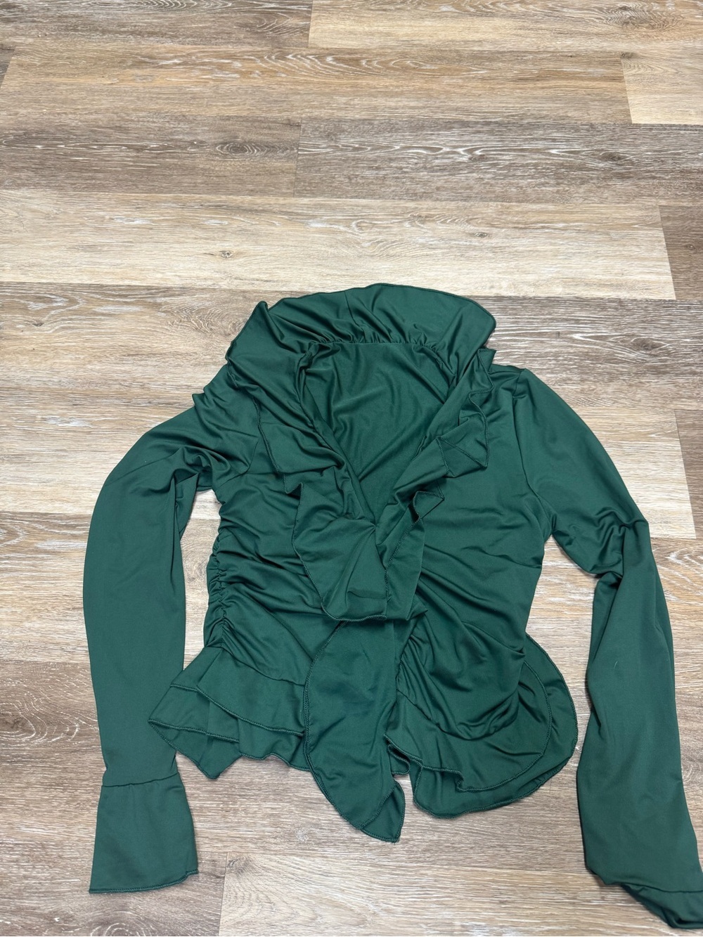 Green ruffled blouse